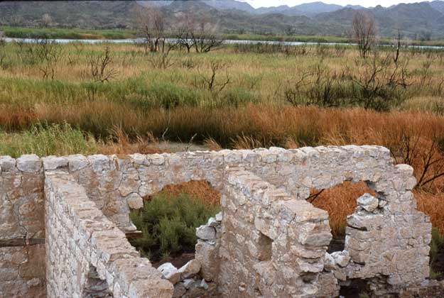 Remains of the old ore processing mill overlook the Colorado River (image source: Plazak)