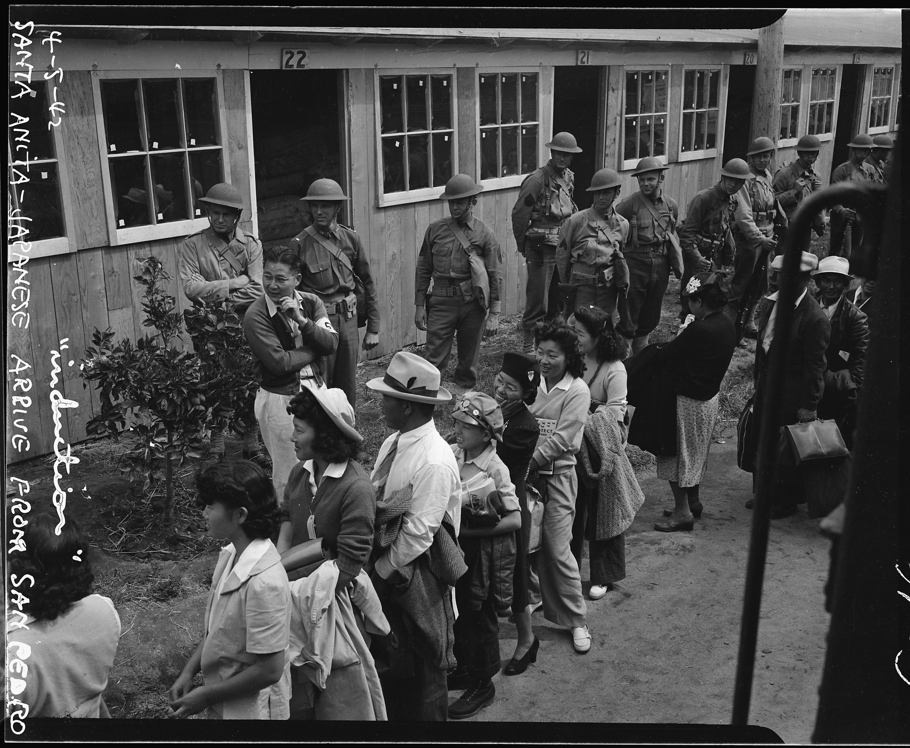 Evacuees of Japanese ancestry arriving at the Santa Anita Assembly center from San Pedro, California