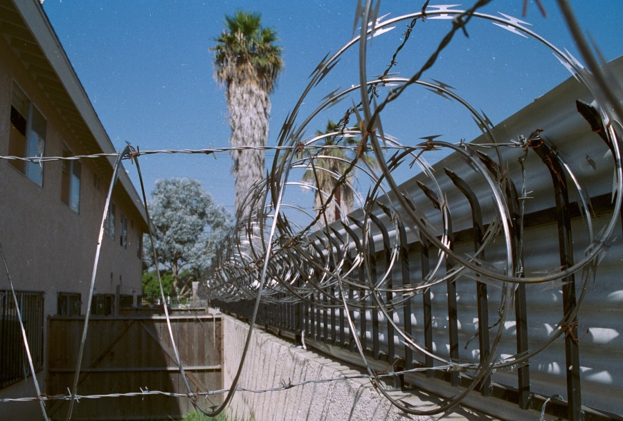 1997.0268.24.6_razor_wire_wall_bars_corrogated_panels